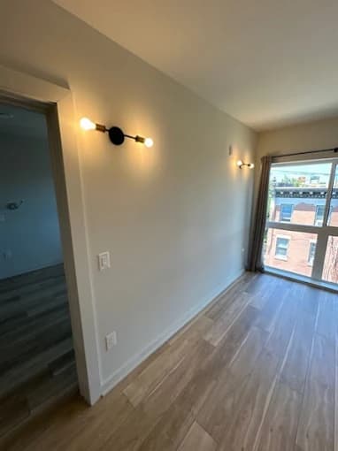 Empty room with two pendant sconces freshly installed