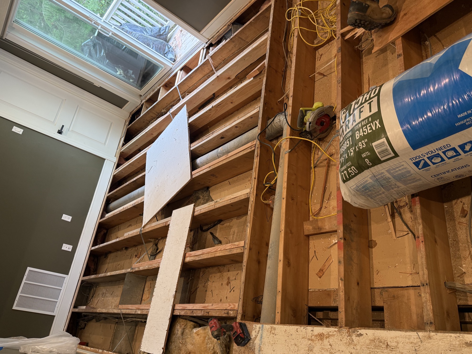 Interior room during flooring renovation with open subfloor
