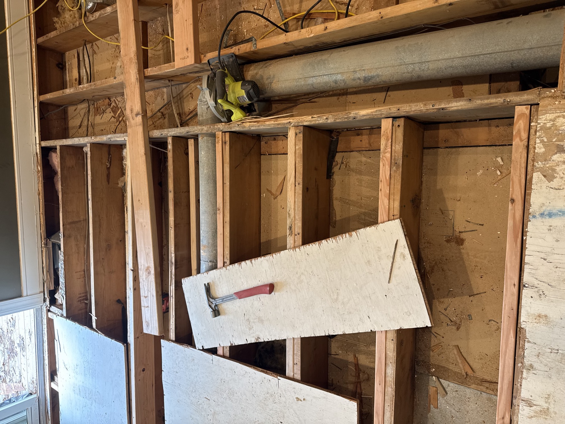 Renovation area with exposed floor framing and insulation