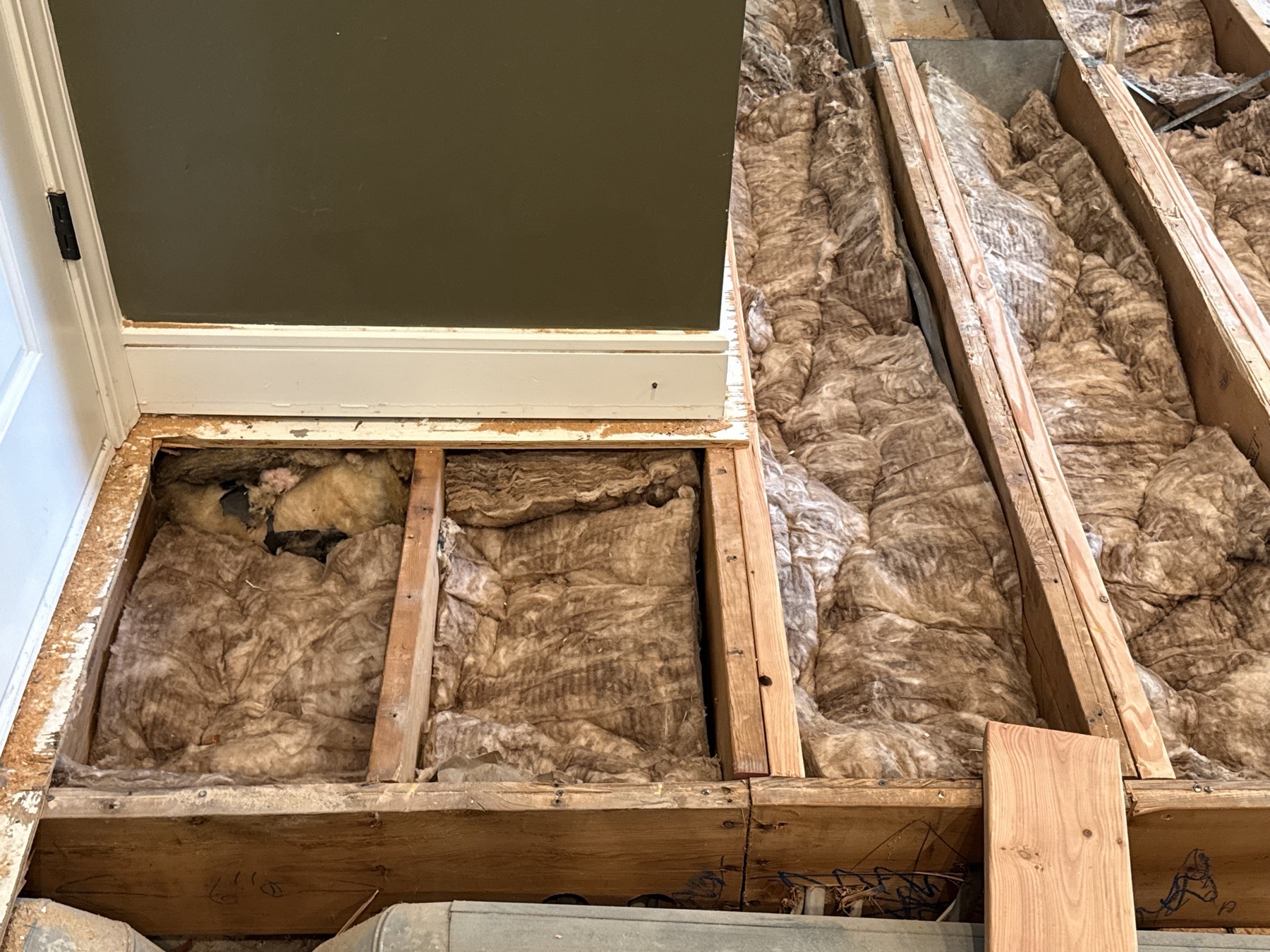 Renovation work area with plywood panels and tools
