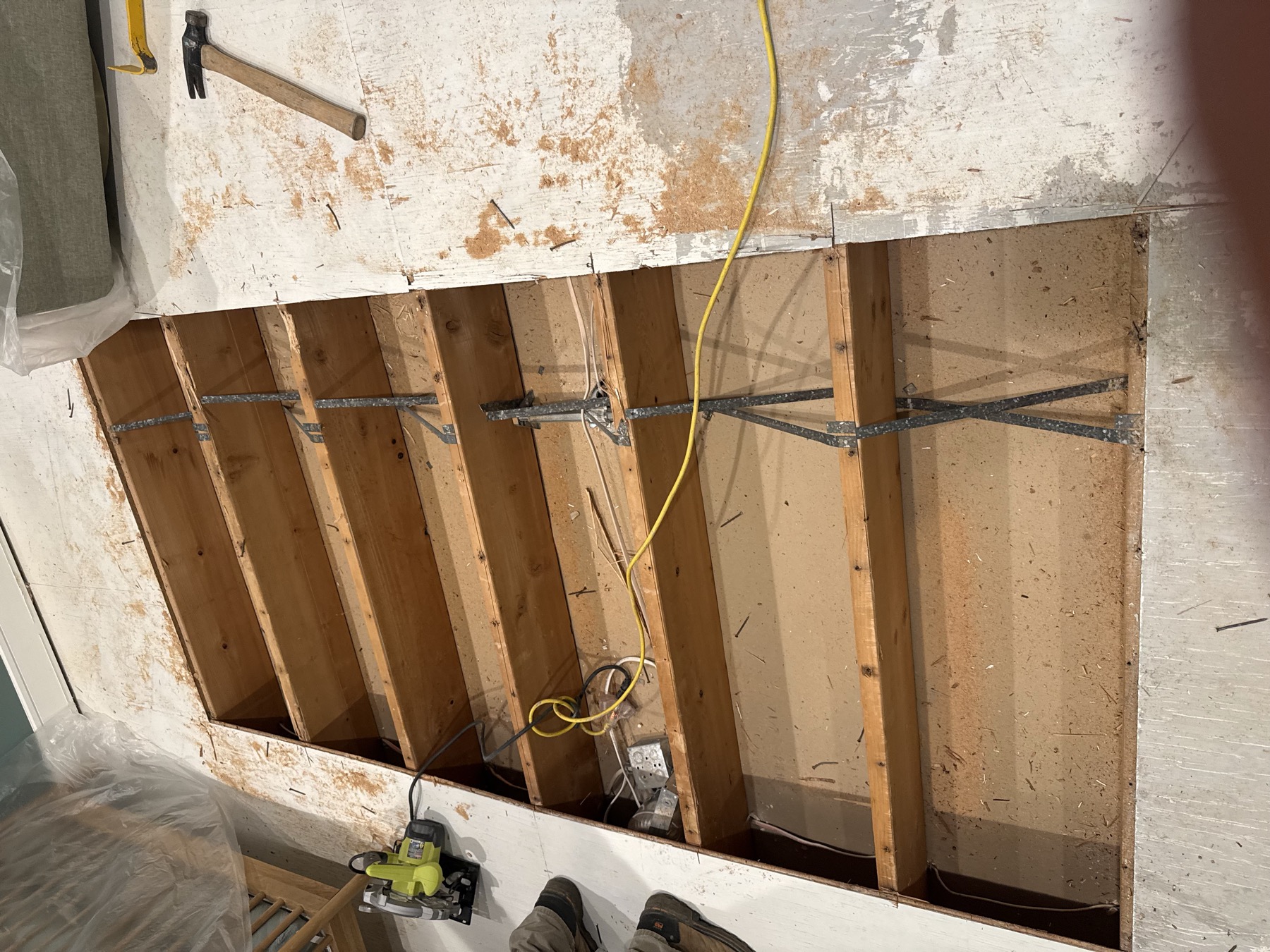 Work area during home repair with flooring removed