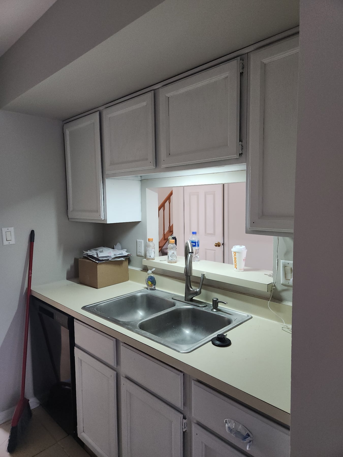 Kitchen sink and pass-through cabinet area